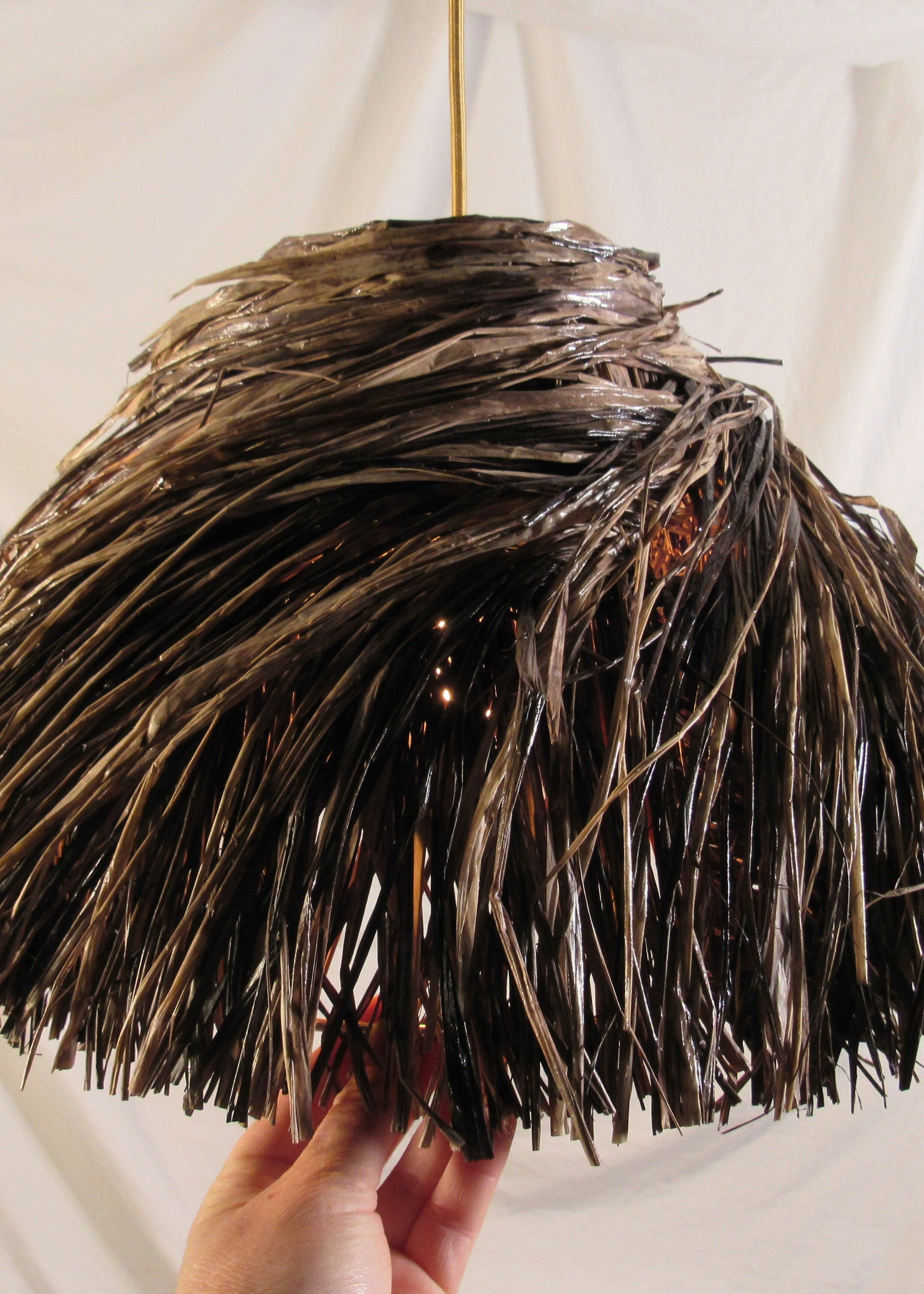 The bird's nest lampshade in dark brown raffia in smaller variant