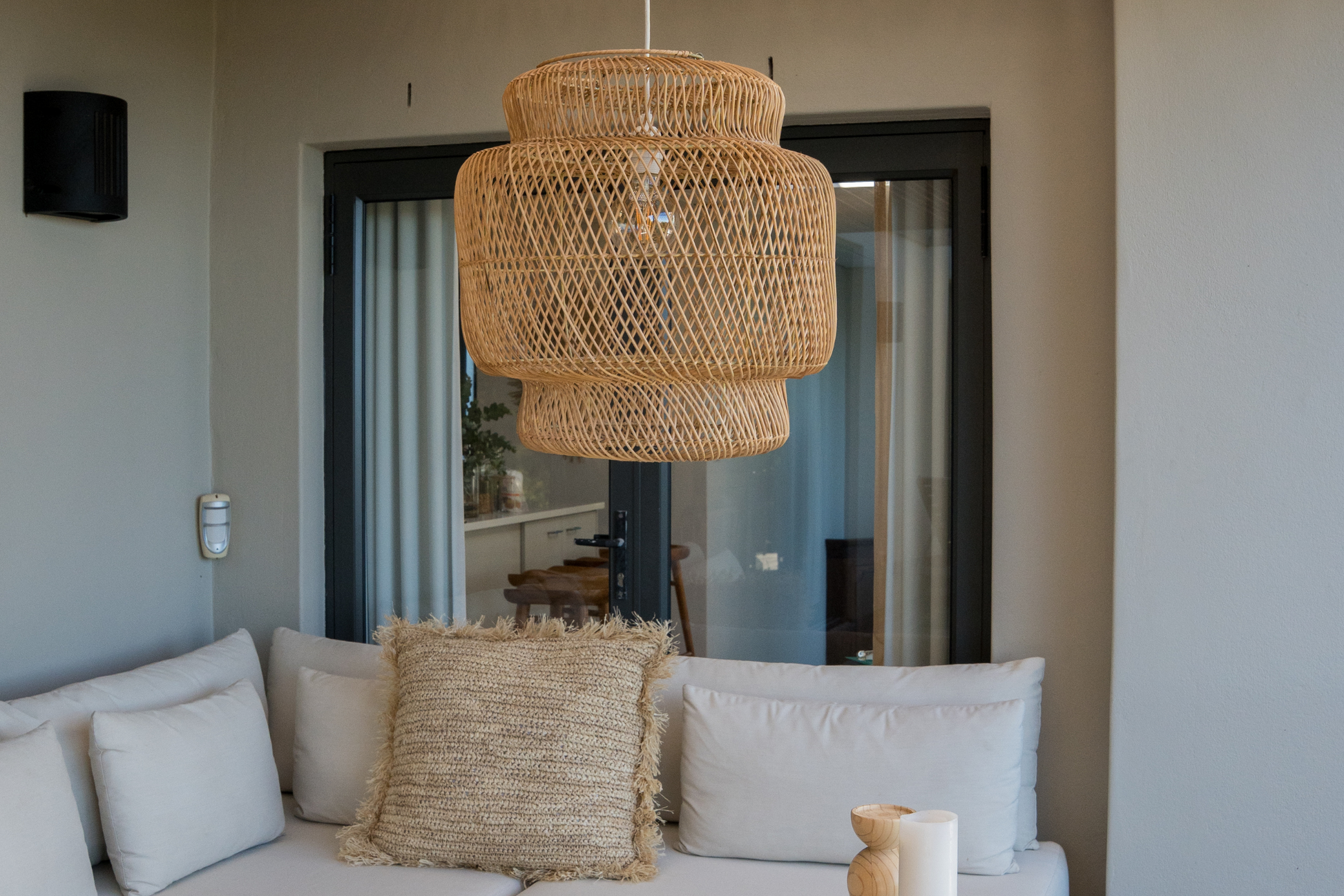 Living room with an outdoor friendly wicker lamp