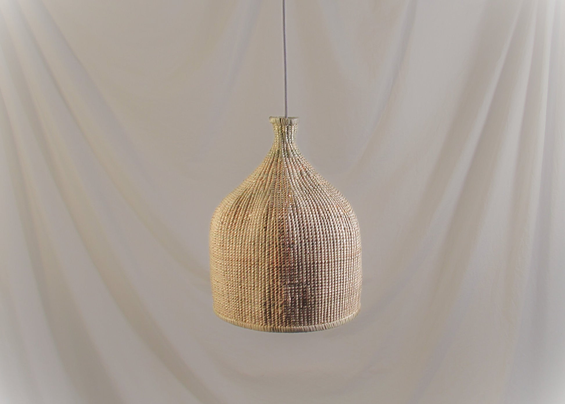 woven pendant ilala grass handmade custom
Modern interior designer lighting fixtures and lampshades, hand woven, locally made for lodges, restaurants, hotels, interior design projects
Kitchen hanging light with dense tight weave 

