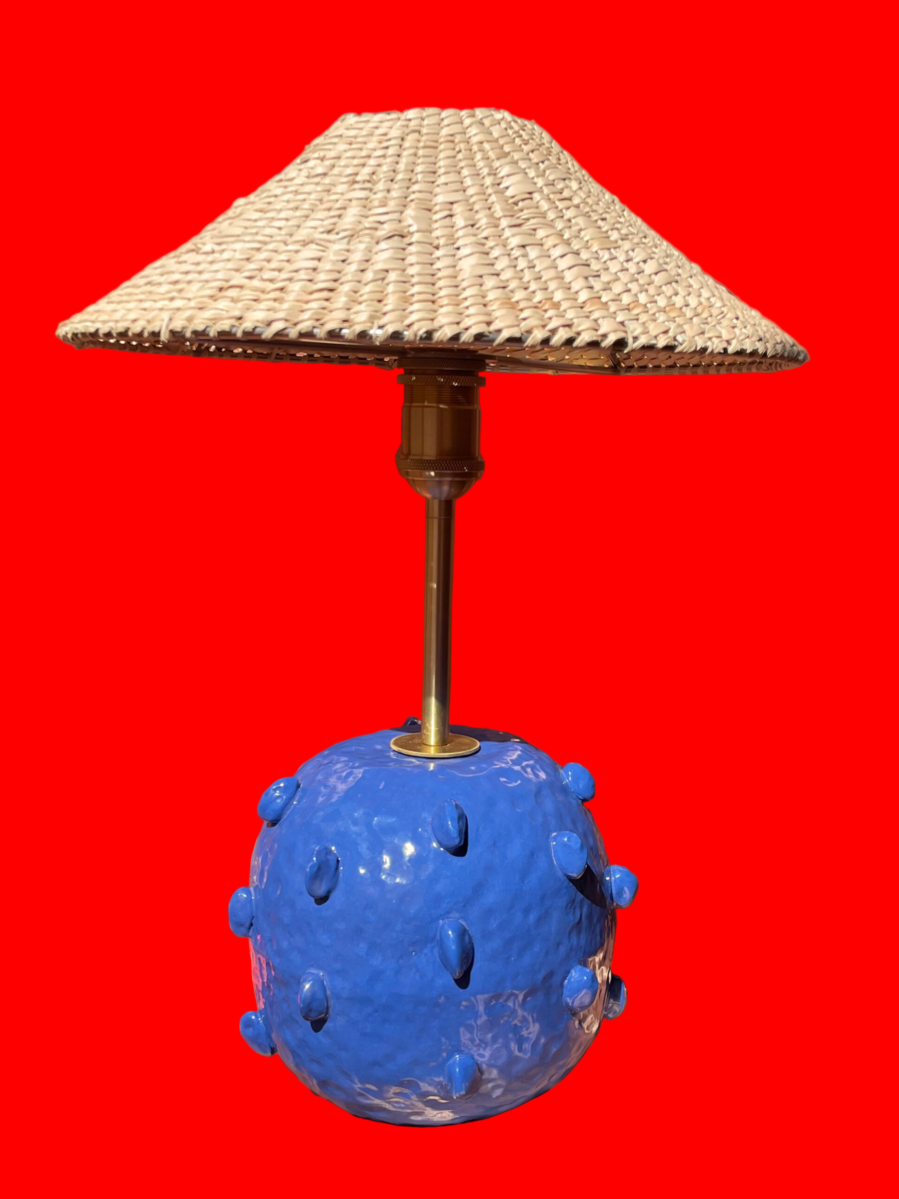 Lamp with a blue spherical base and wicker shade brass fixtures custom cord