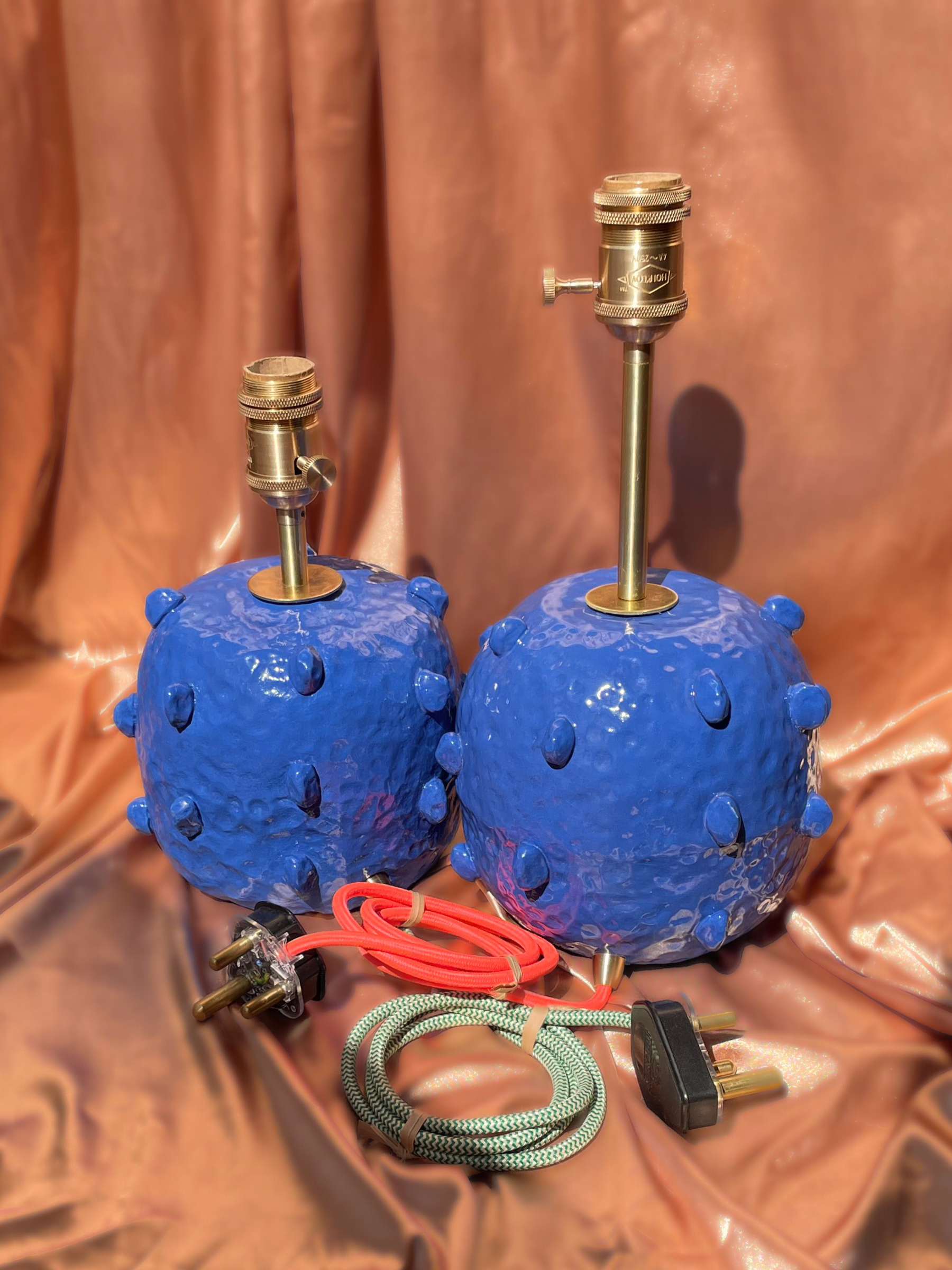 Two blue textured table lamps with brass fittings handmade ceramics