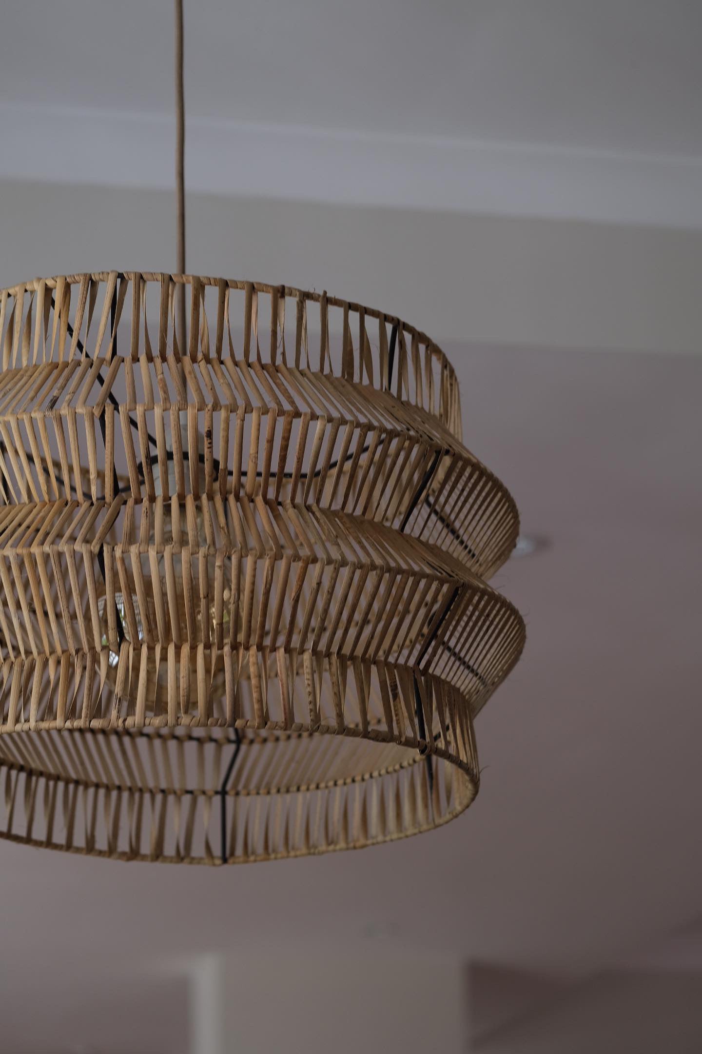 The Safari pendant on black powder coated frame from rattan peel, perfect for indoor and outdoor environments, hand woven, locally made, customisable. Great for resorts, hotels, restaurants, ambient lighting
