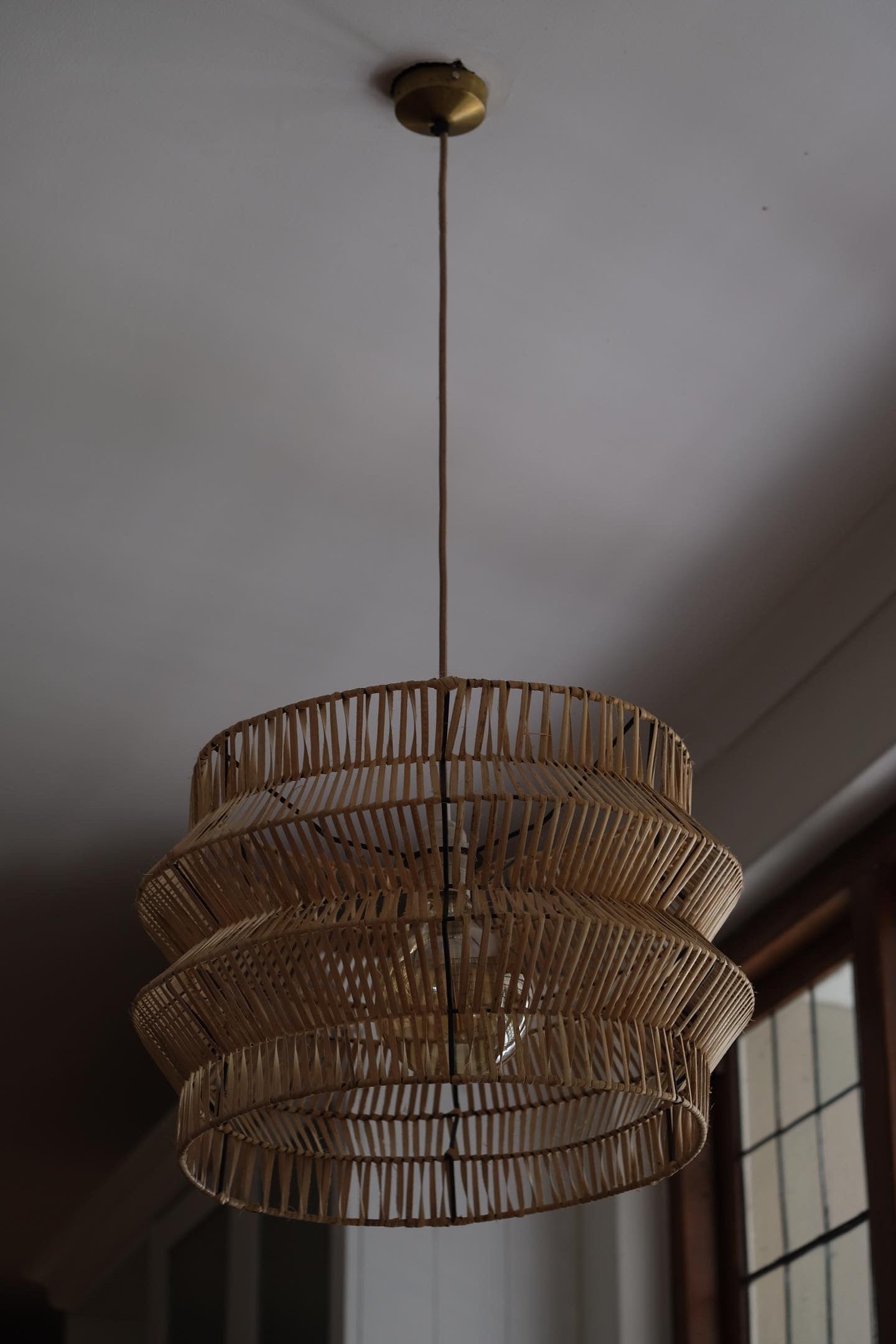 The Safari pendant hand woven on black powder coated frame from rattan peel, perfect for indoor and outdoor environments, hand woven, locally made, customisable. Great for resorts, hotels, restaurants, ambient lighting. Kitted with a custom champagne color cord and brass ceiling cup.
