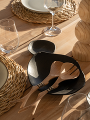 Our collection of plant oil polished Olive Wood salad servers with cattle bone from the Eastern Cape. Uniquely designed to suit modern environments that appreciate sustainable, classic, quality design. Patterns may vary. 