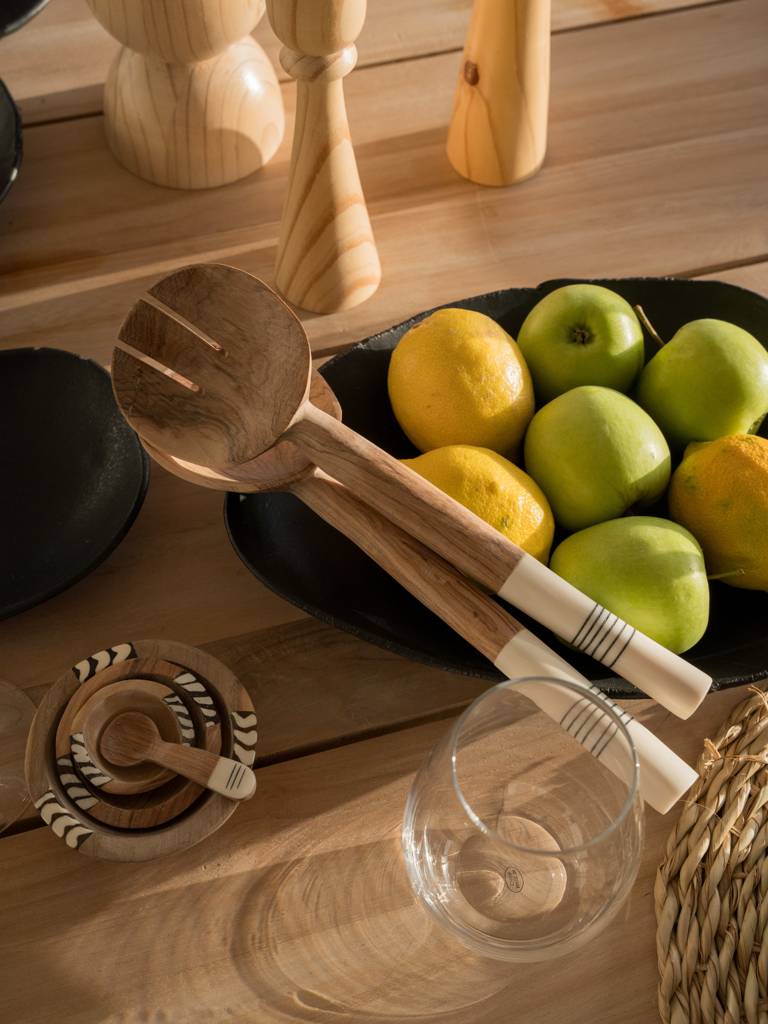 Our collection of plant oil polished Olive Wood salad servers with cattle bone from the Eastern Cape. Uniquely designed to suit modern environments that appreciate  sustainable, classic, quality design. Patterns may vary.