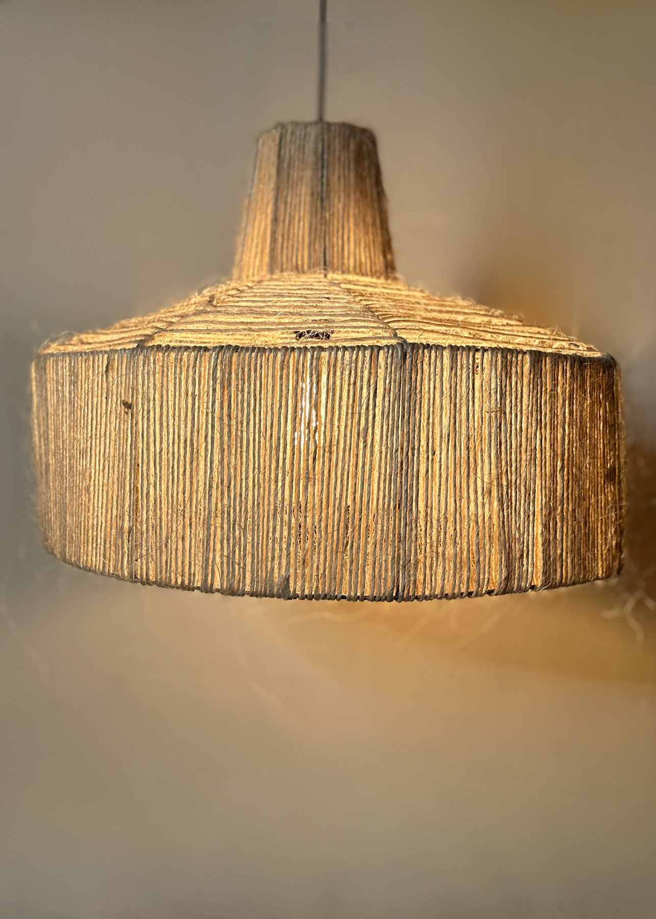 Close up of the Sisal pendant on stainless steel frame, suitable for indoors and outdoors, bespoke locally made lighting, fully customisable

