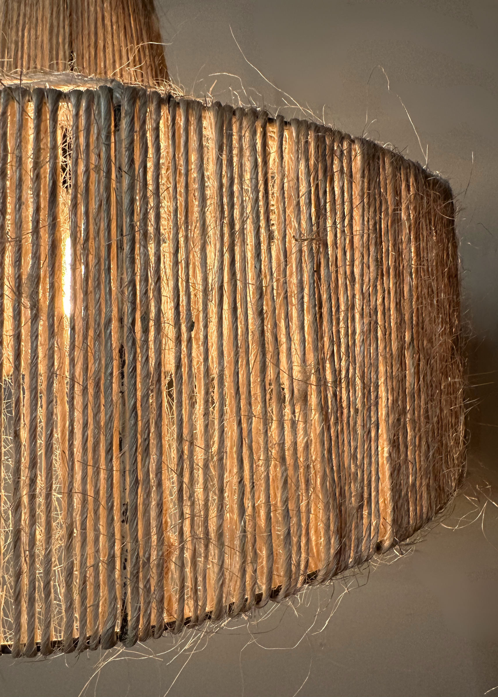 Close up of the Sisal pendant on stainless steel frame, suitable for indoors and outdoors, bespoke locally made lighting 
