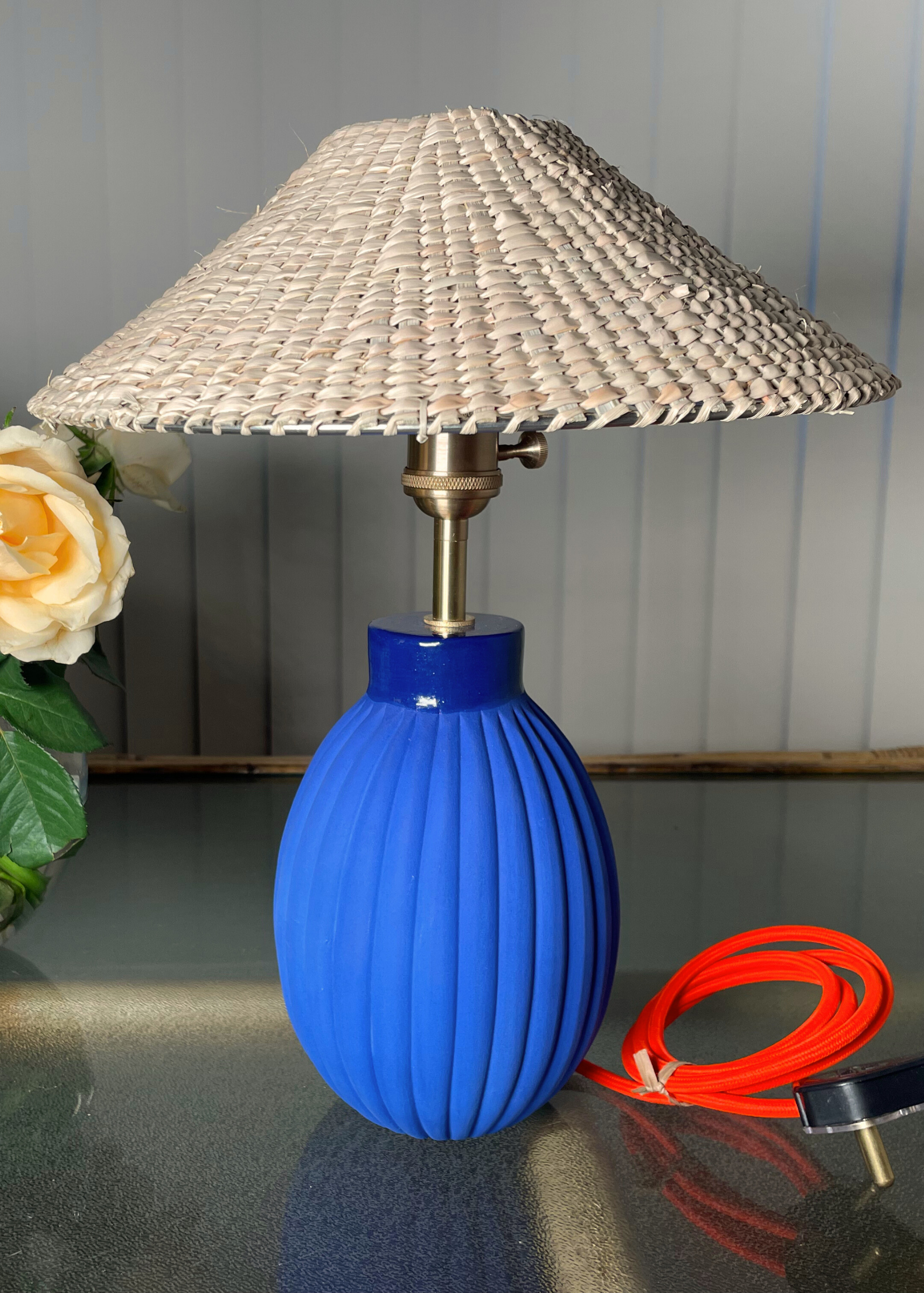 Blue table lamp with a wicker shade  brass fixtures custom cord