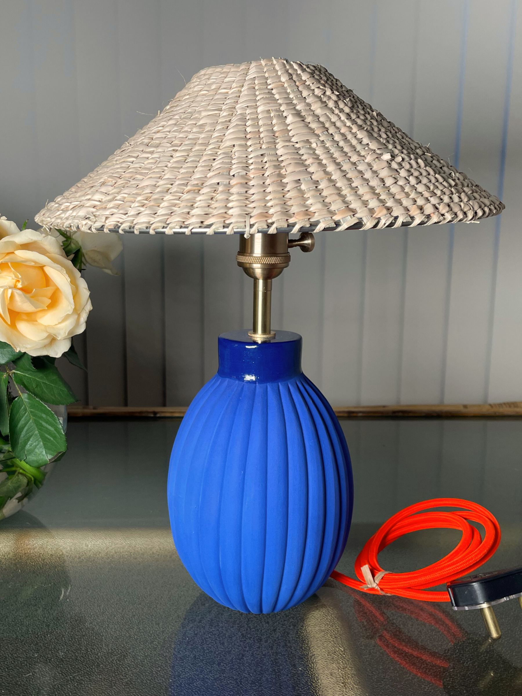 Blue table lamp with a wicker shade  brass fixtures custom cord