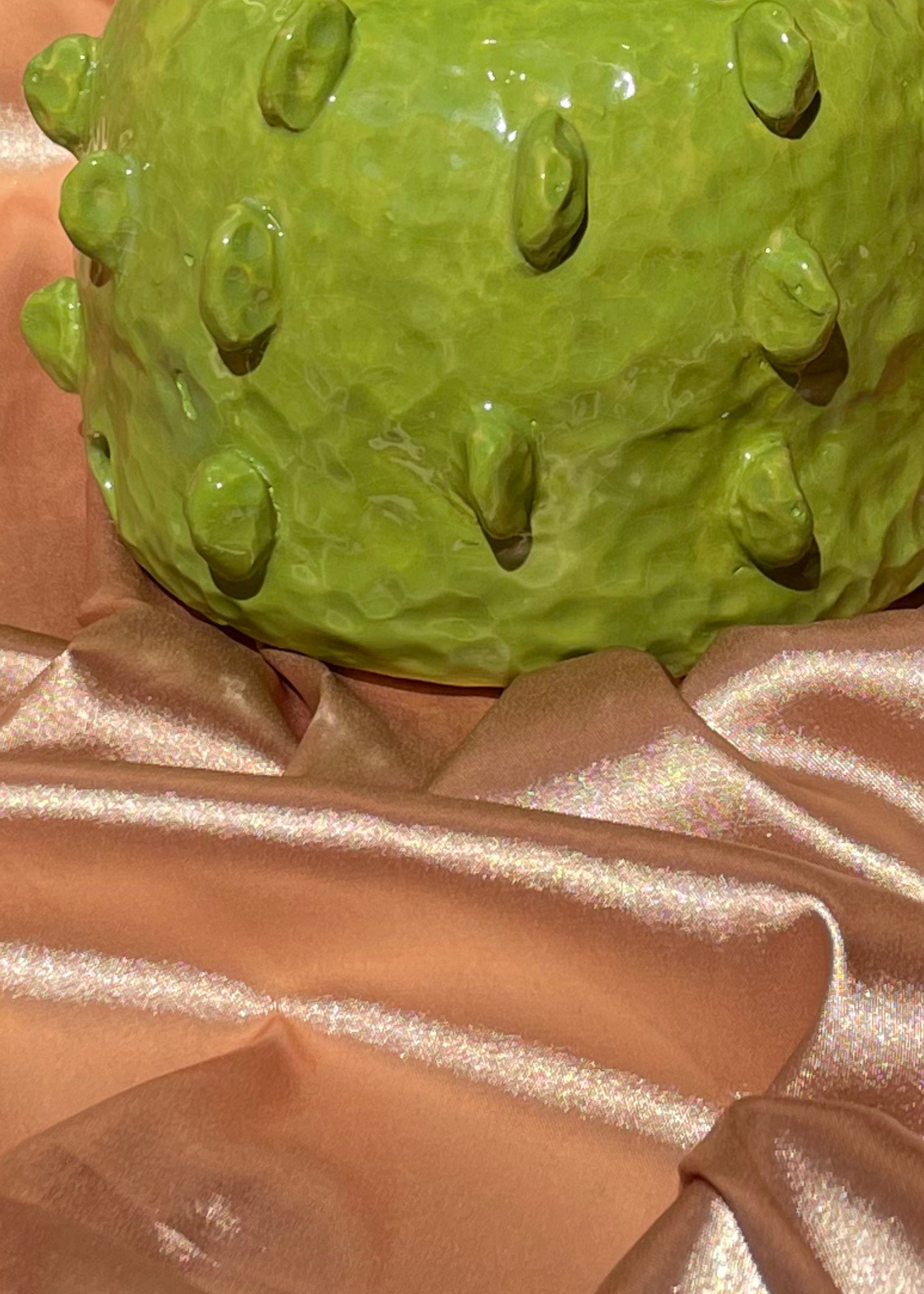 Close-up of a green ceramic lamp base  brass fixtures custom cord