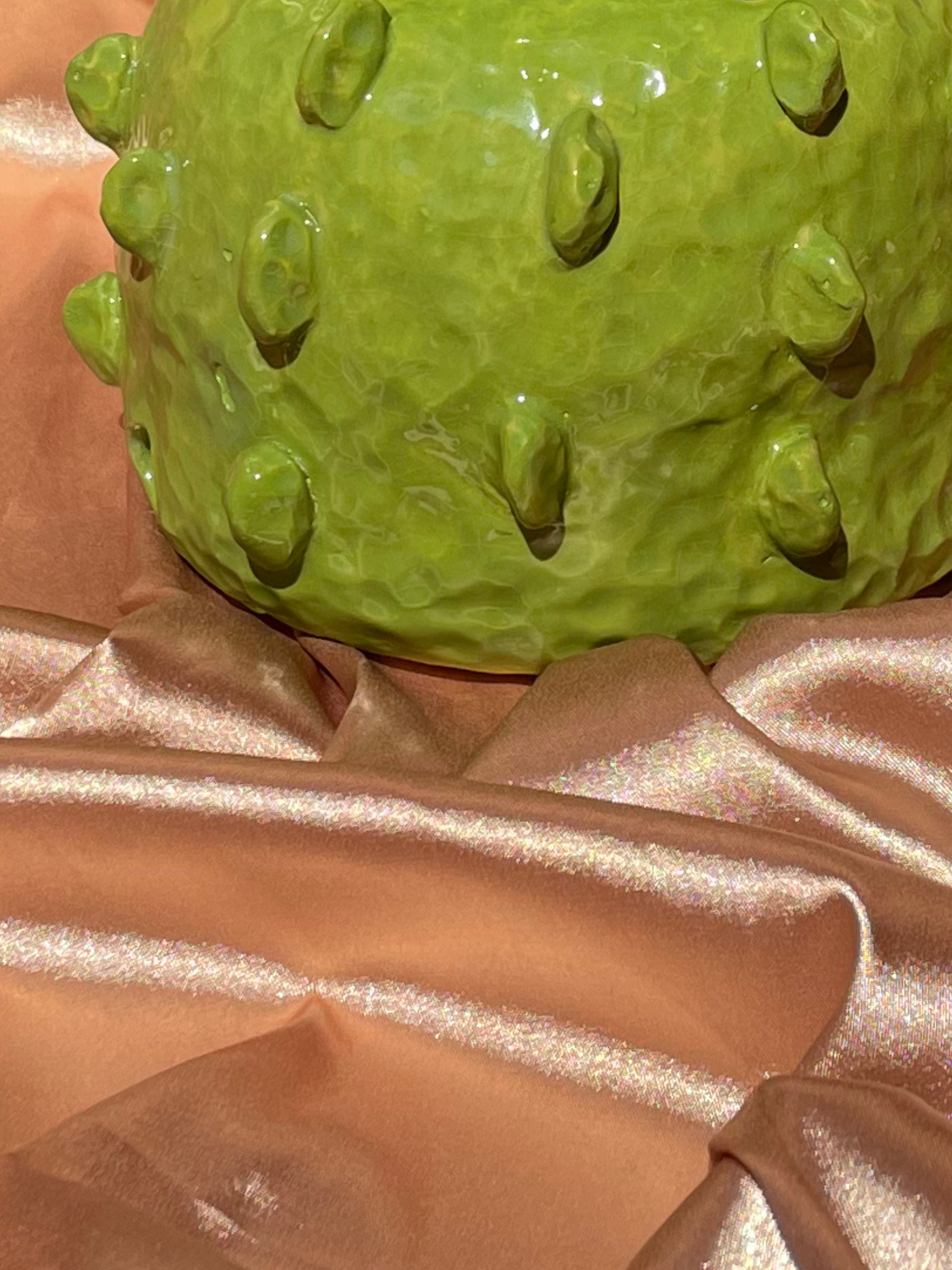 Close-up of a green ceramic lamp base  brass fixtures custom cord