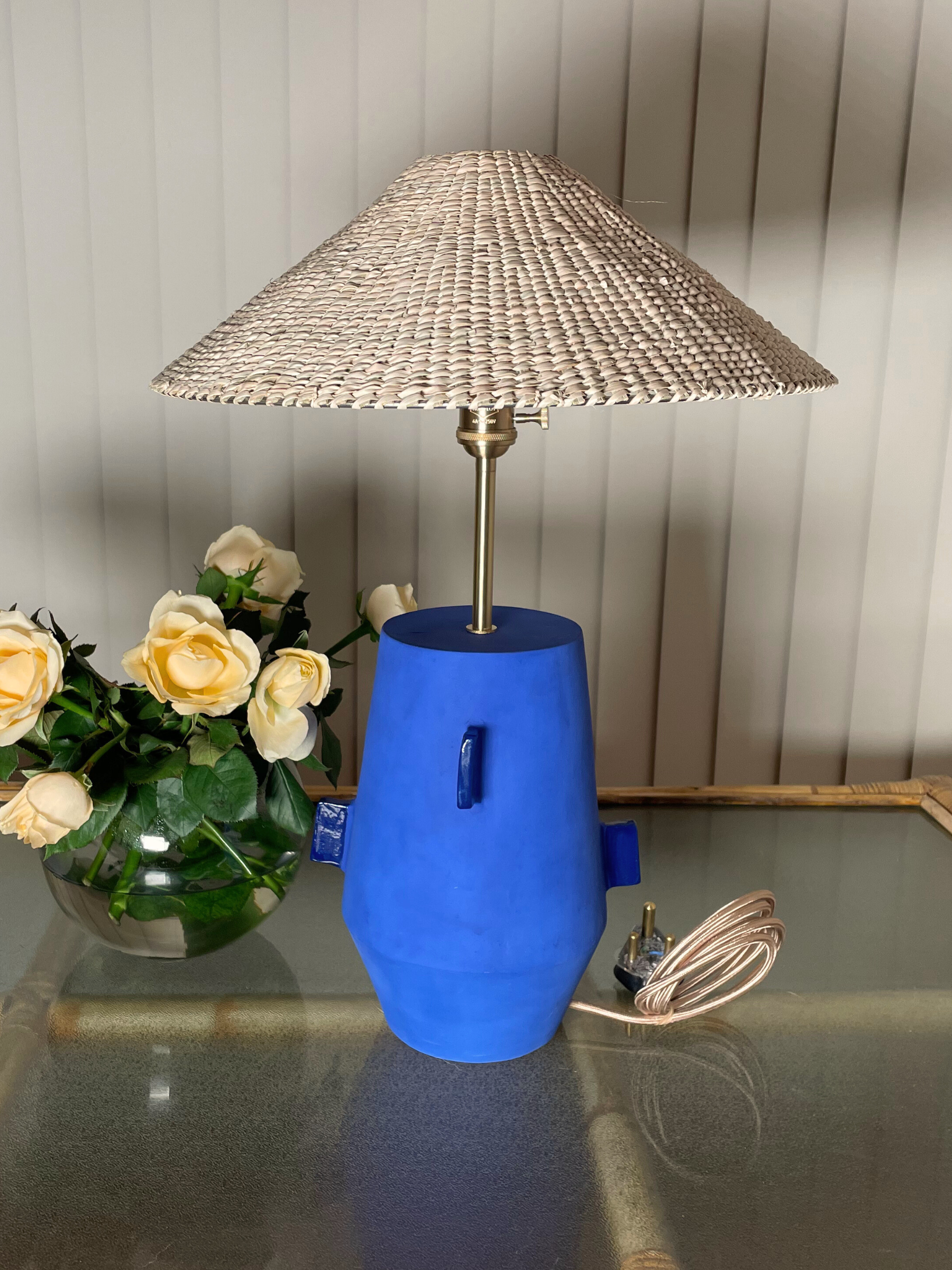 Blue table lamp with a wicker shade  brass fixtures custom cord