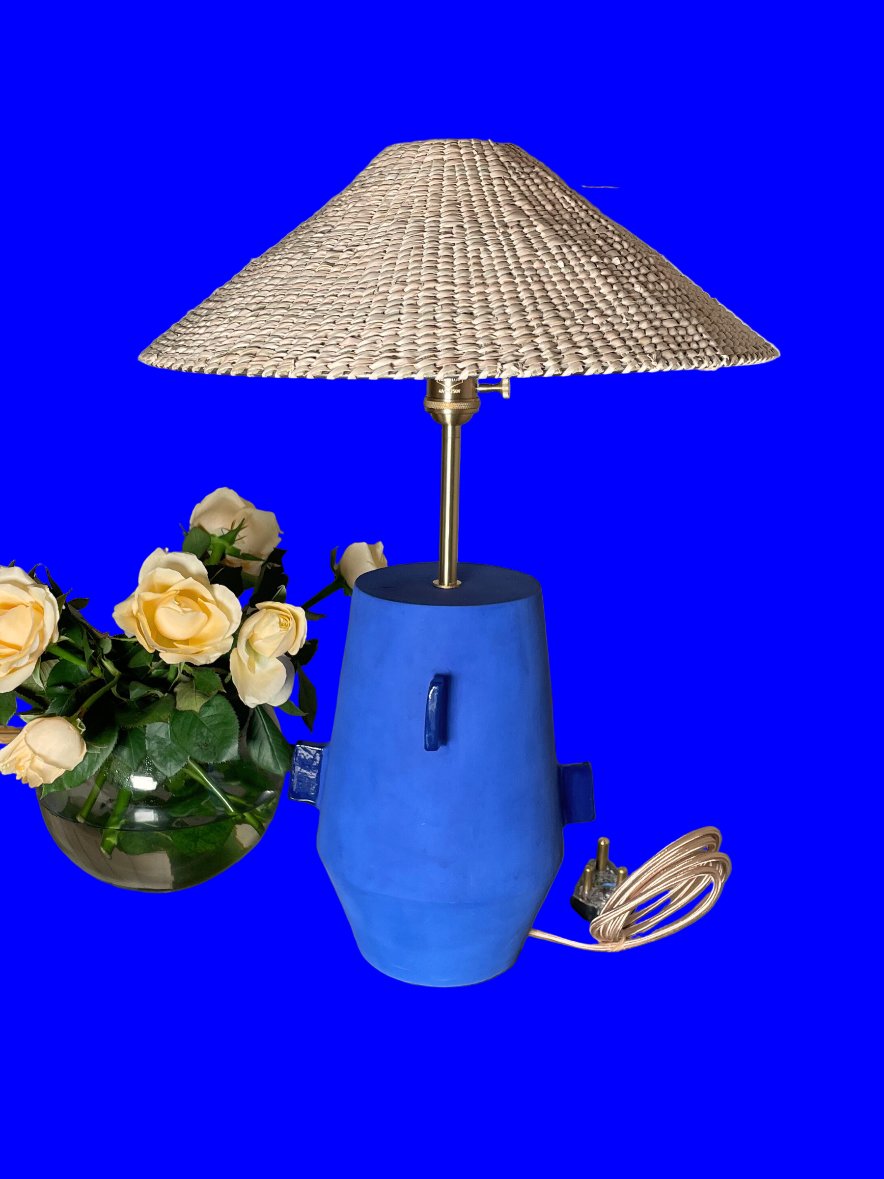 Blue table lamp with a wicker shade brass fixtures custom cord