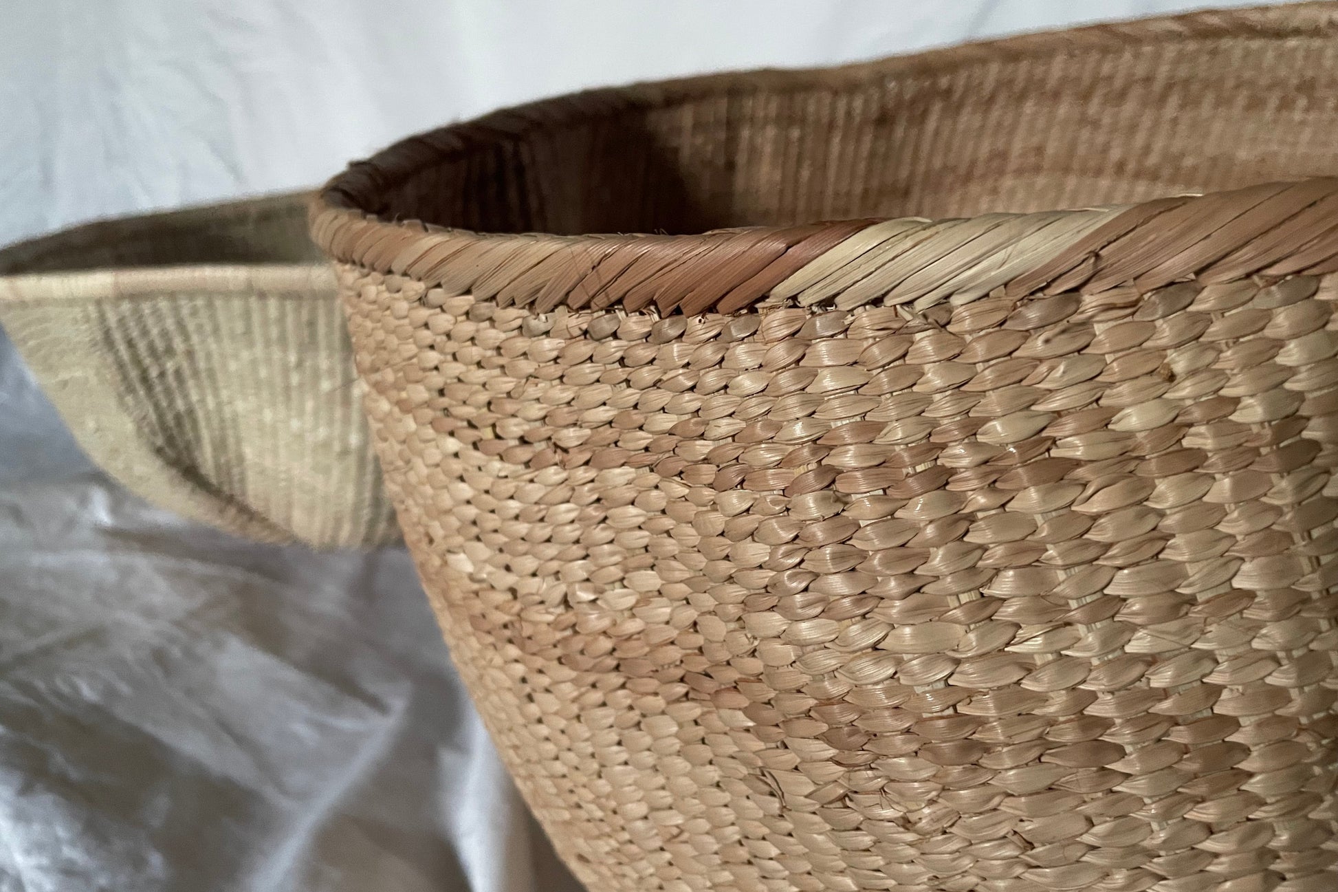 Ndebele woven basket from natural fibres for home decor, soft furnishings, lodges, restaurants, property developments and interior projects, in beautiful hues of brown, peach, and beige