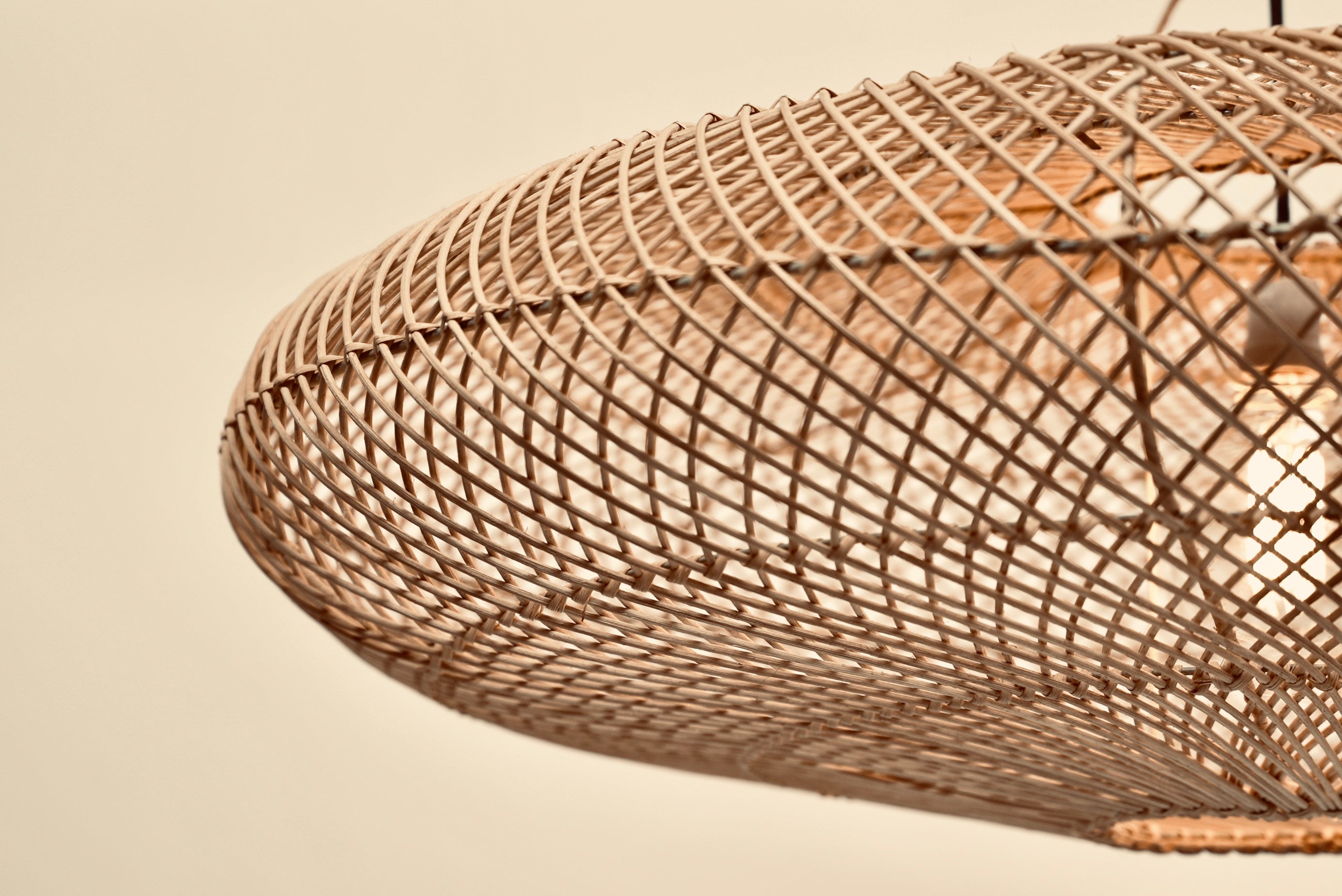 The UFO pendant woven with bamboo on stainless steel frame locally made and customisable for dining room bedroom restuarants lodges hotels and renovation projects on wholesale or retail