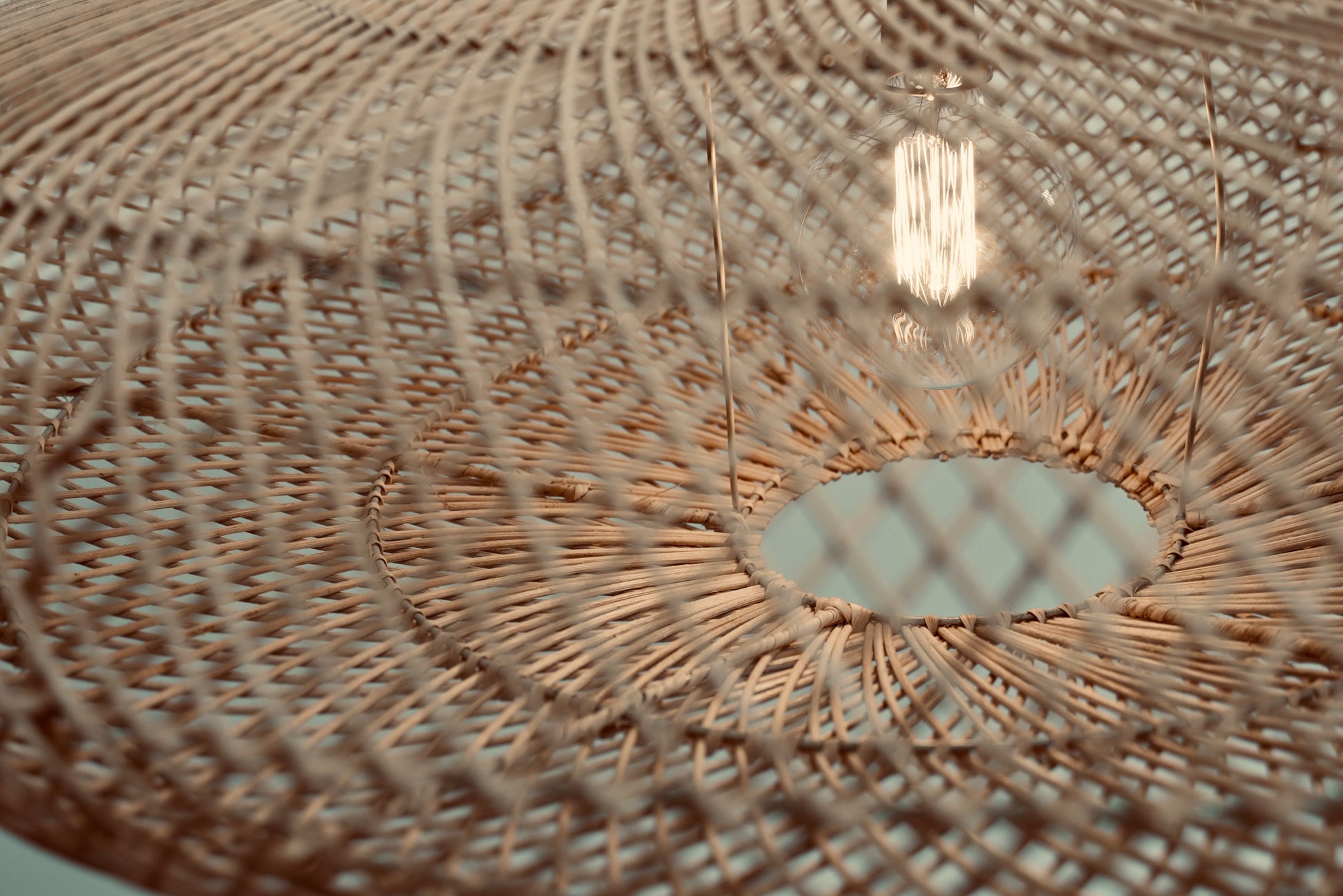 The UFO pendant woven with bamboo on stainless steel frame locally made and customisable