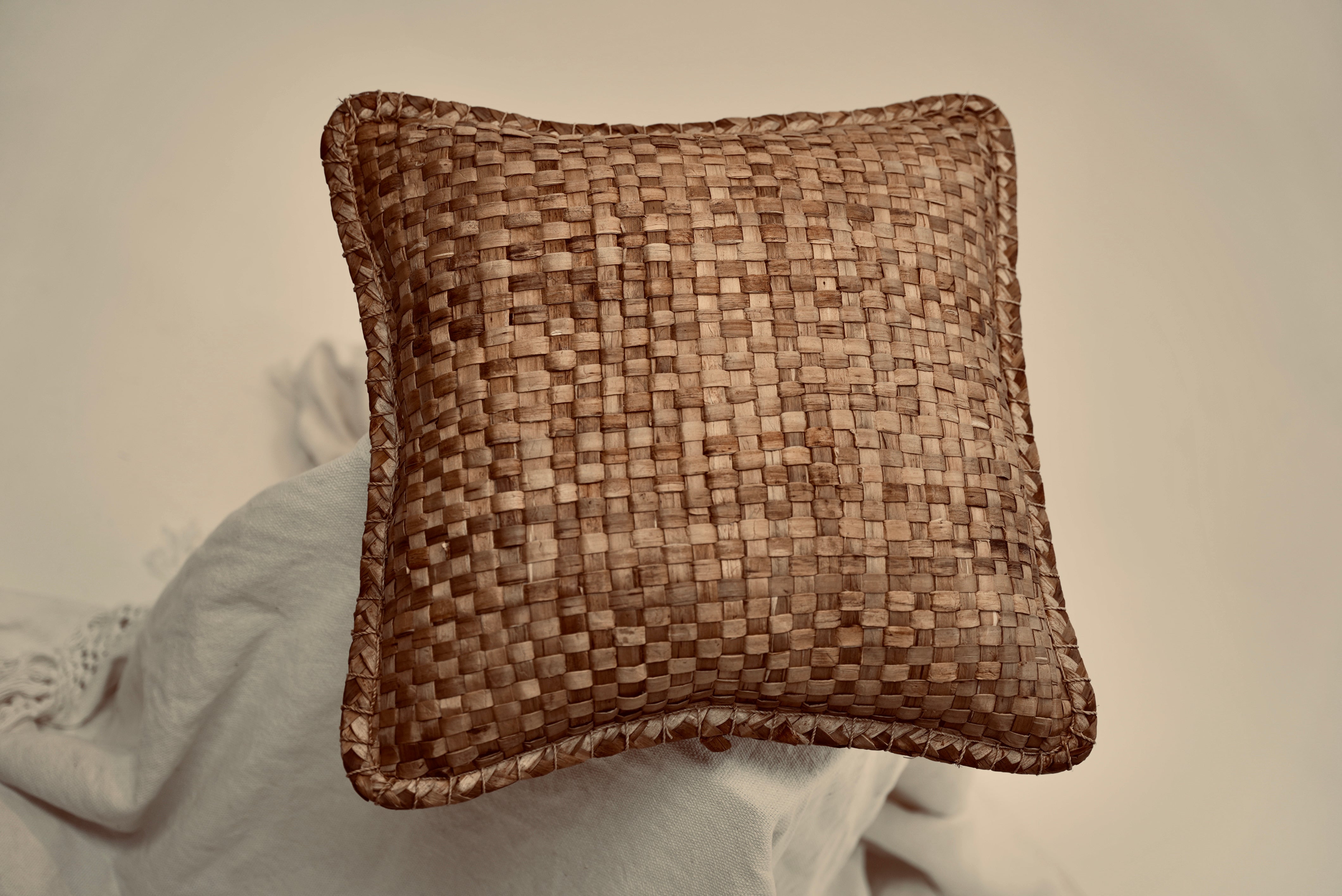 The crispy woven cushion photographed to showcase the intricate weaving pattern