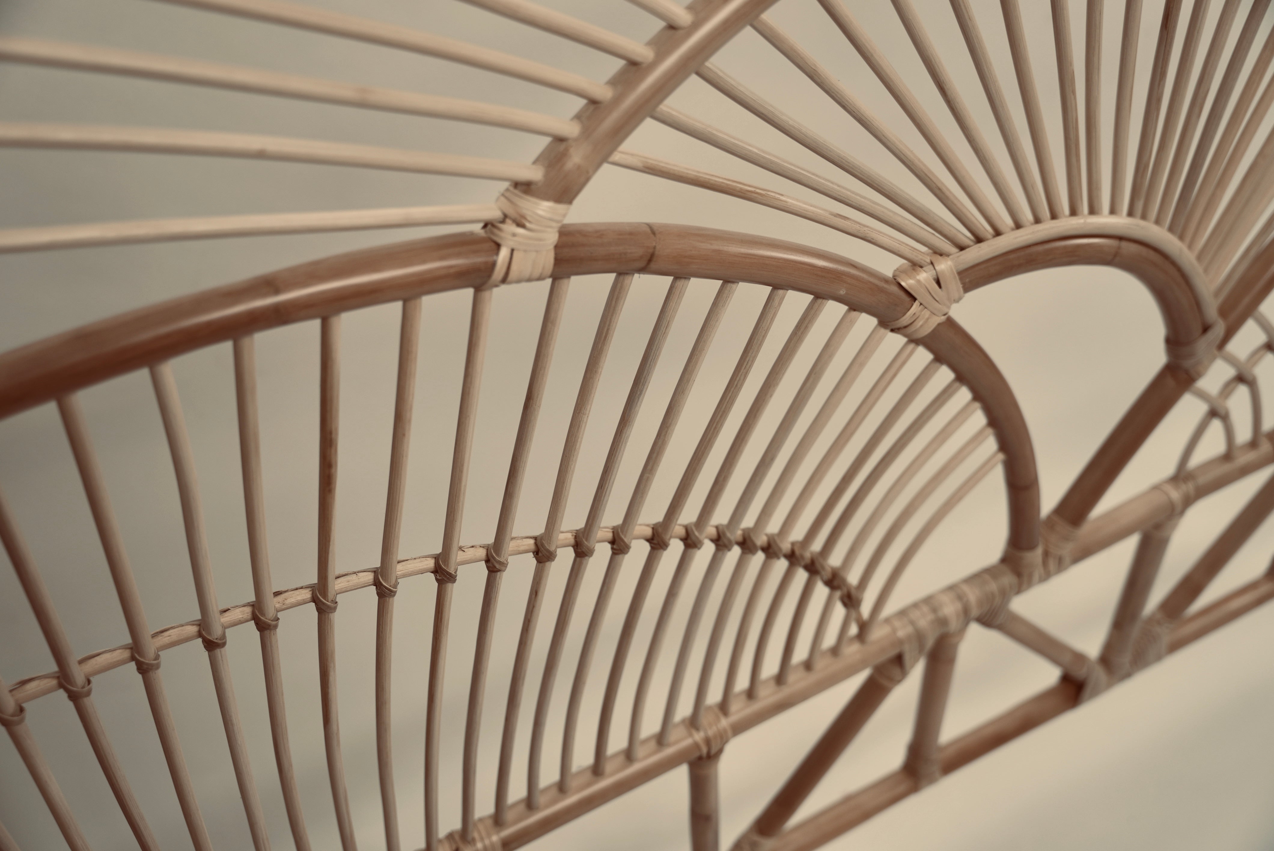 The Muji headboard photographed against a neutral wall showcasing the intricate curved details