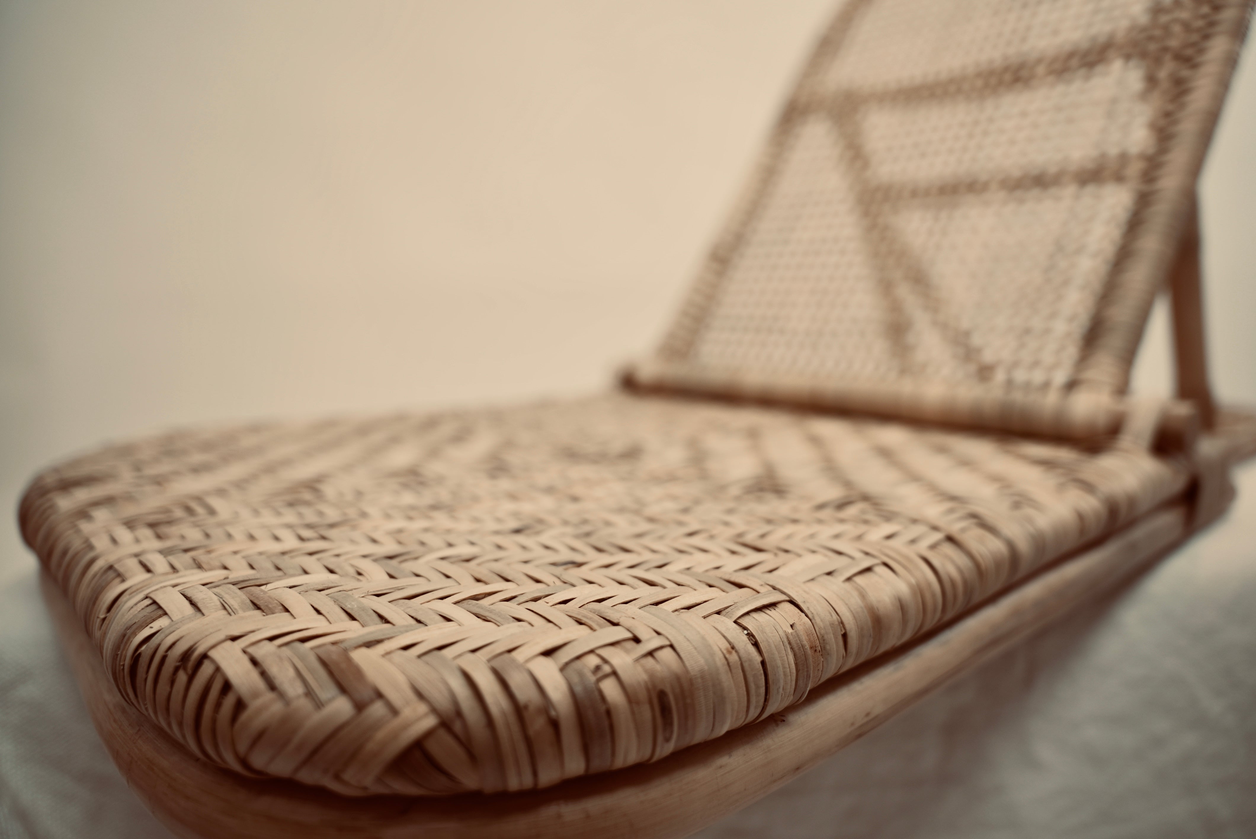 A close-up of the foldup Rattan beach chair handmade for luxury outdoors