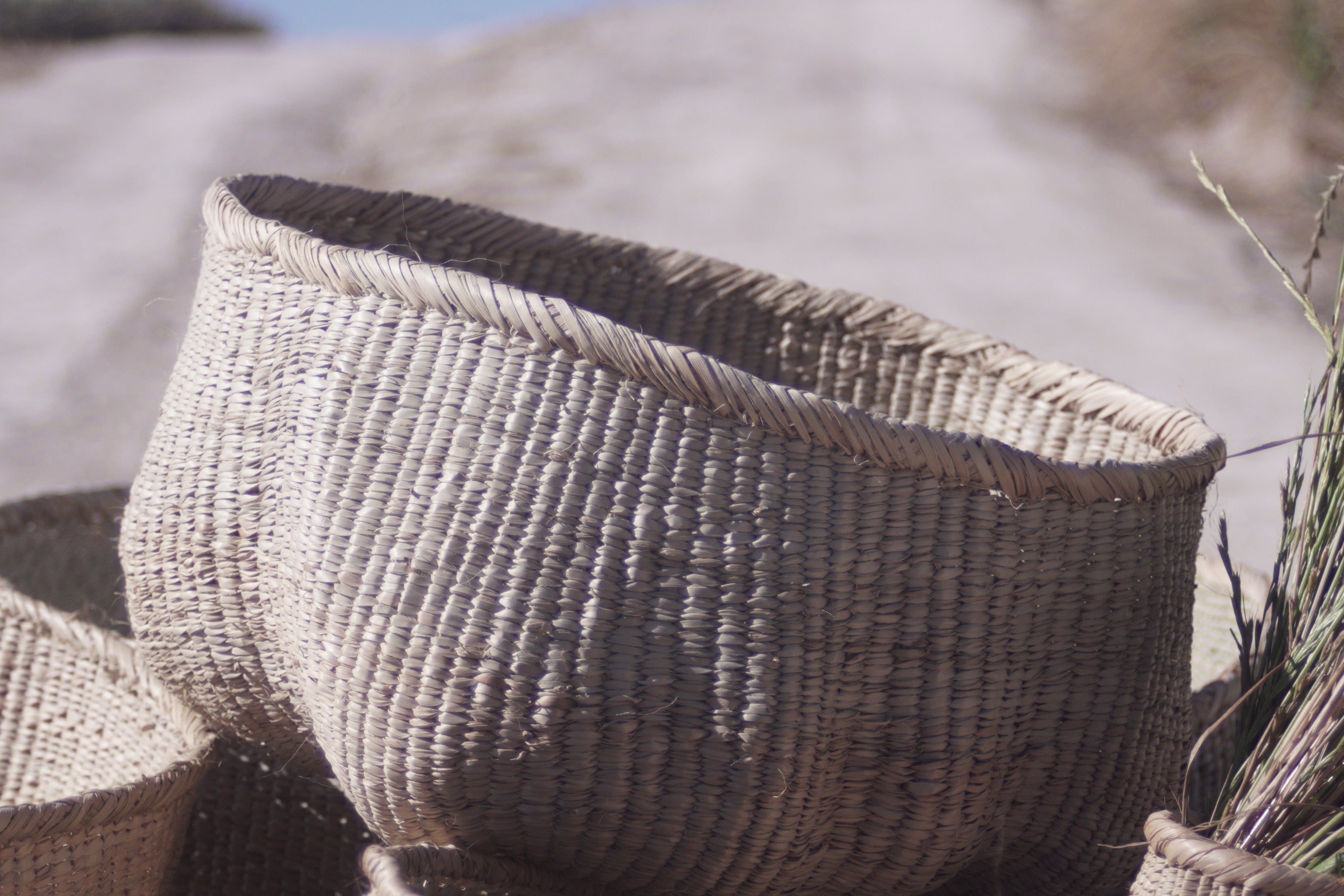 Ndebele woven wonky basket handmade from natural fibres for home decor, soft furnishings, lodges, restaurants, property developments and interior projects in various customisable sizes