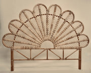 The Rattan Ibu headboard photographed against a neutral headboard